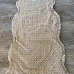 Alpakafell Sitzauflage Rückseite